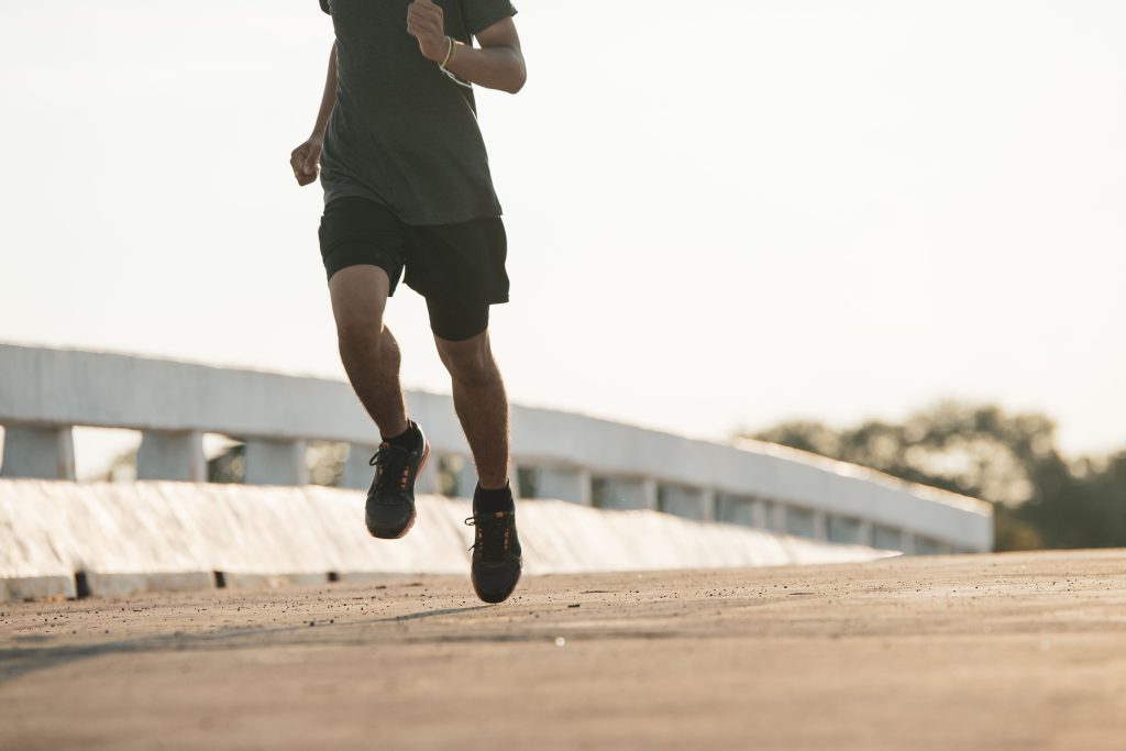 silhouette-young-fitness-man-running-sunrise